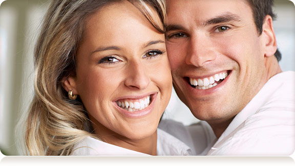 smiling adult couple