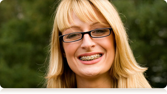 smiling young woman with braces